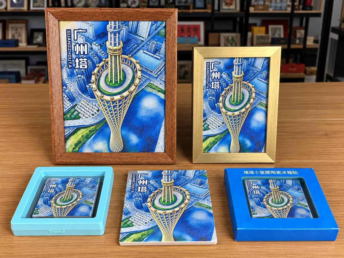 One Canton Tower design made five ways: two framed pieces of different sizes, a magnet in a display box, a bare tile and a magnet in a retail box.