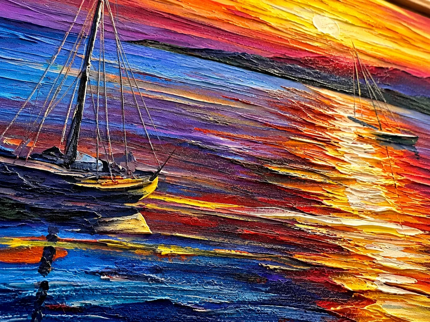 Close view of a sunset seascape with sailboats, its brushstrokes raised as glossy texture.