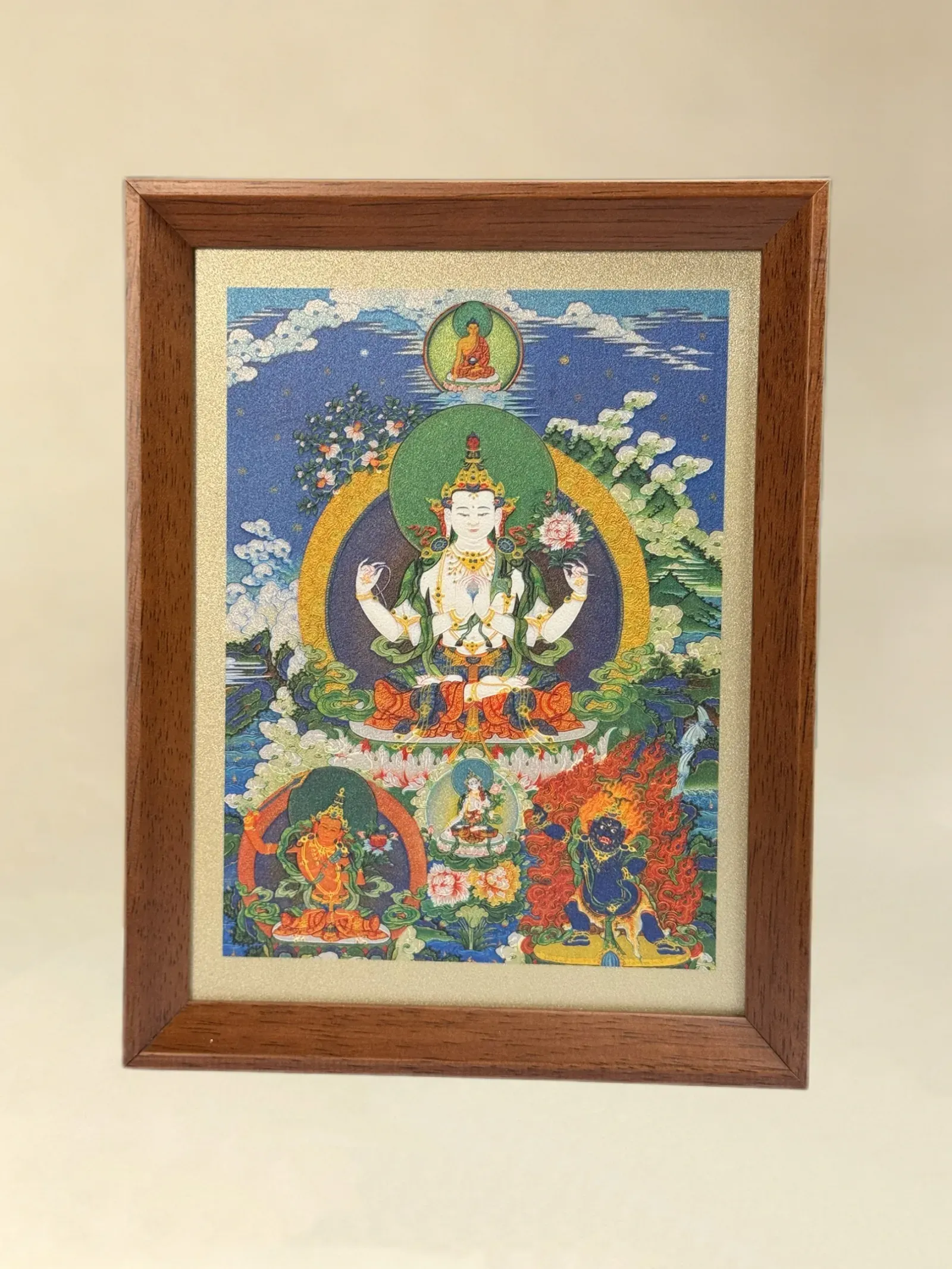 The same Four-Armed Avalokiteshvara relief artwork in a wood desktop frame.