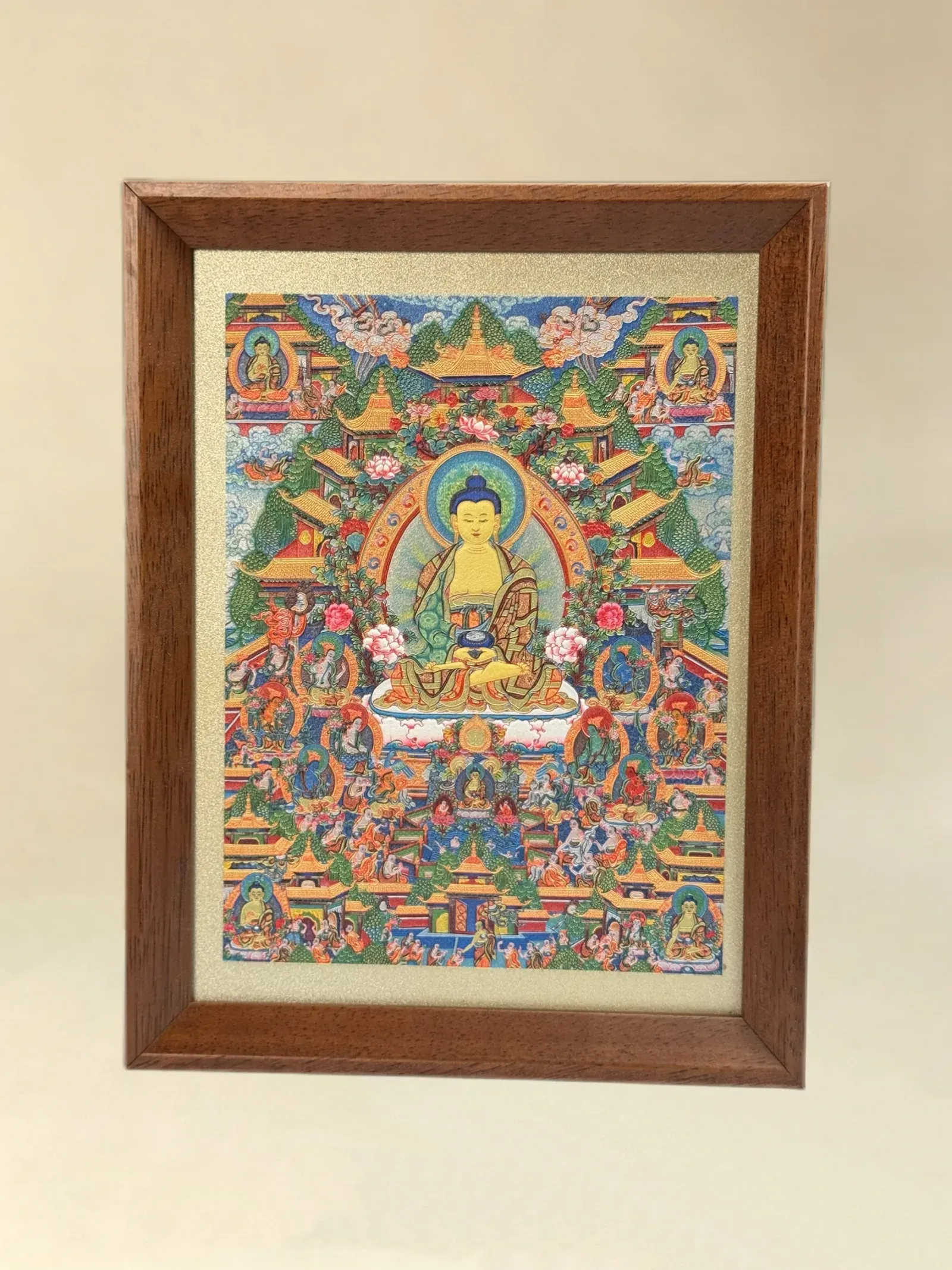 A relief artwork of Shakyamuni Buddha, as a desktop frame, photographed front on.