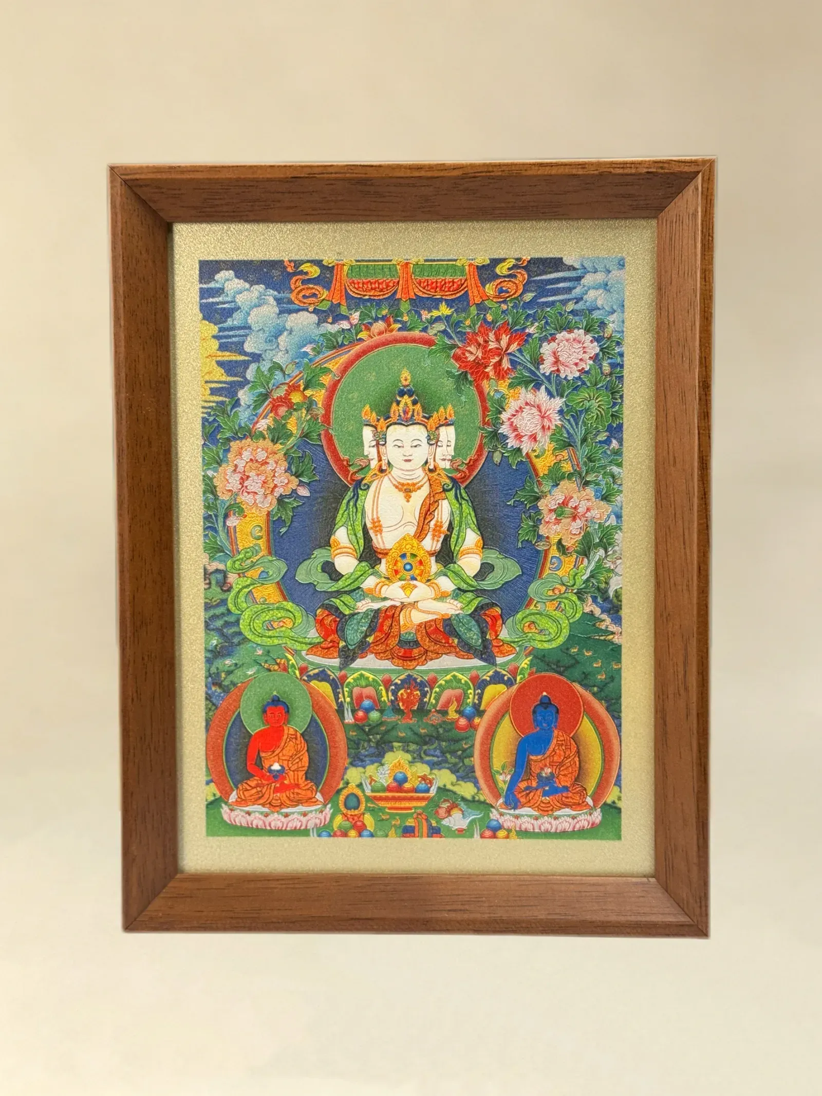A relief artwork of Vairocana, as a desktop frame, photographed front on.