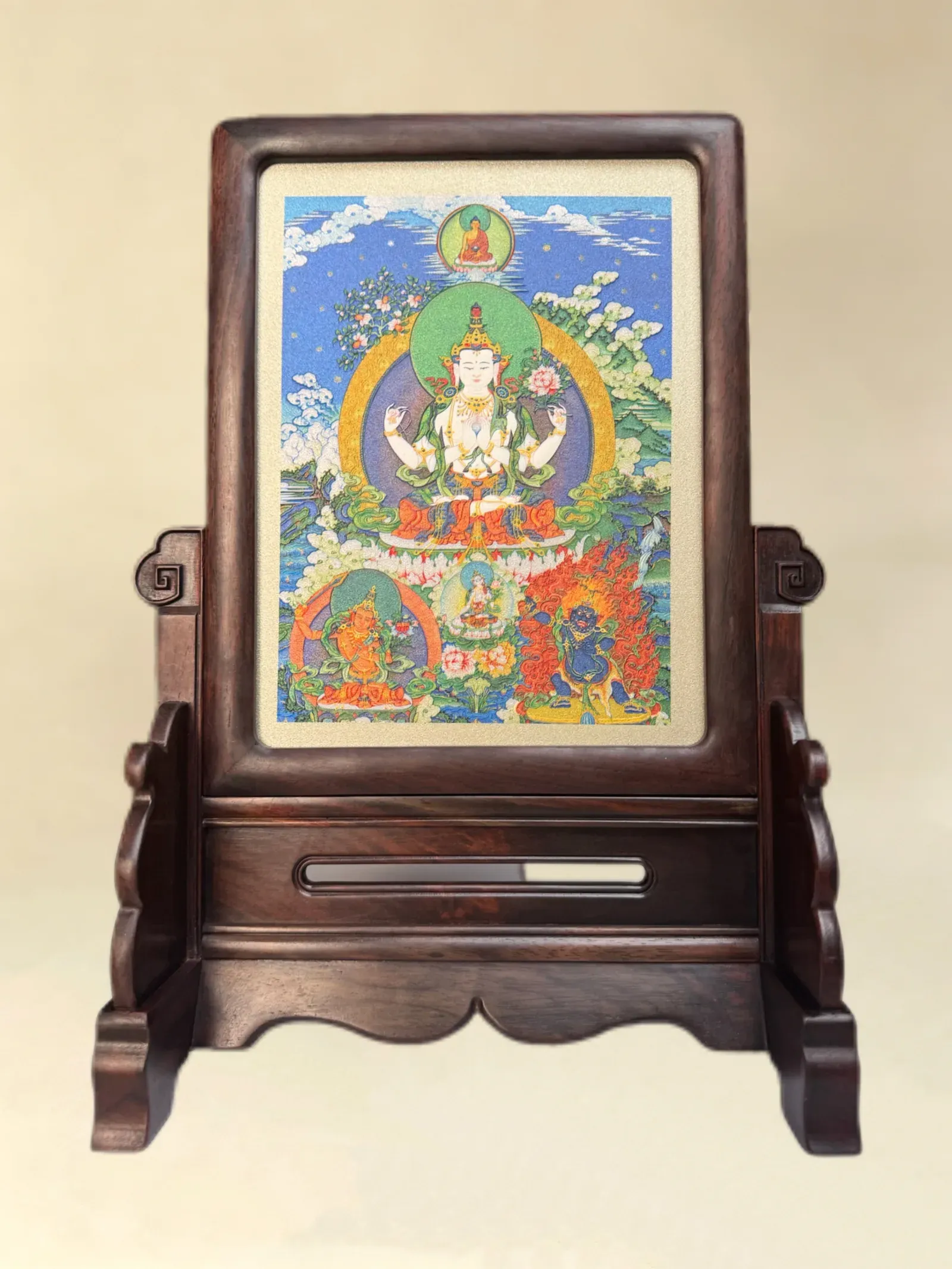 A Four-Armed Avalokiteshvara relief artwork held in a dark wood table-screen stand.