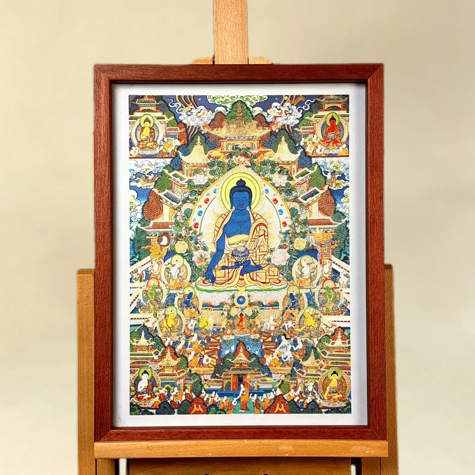 A relief artwork of Medicine Buddha, as a wall piece, photographed front on.
