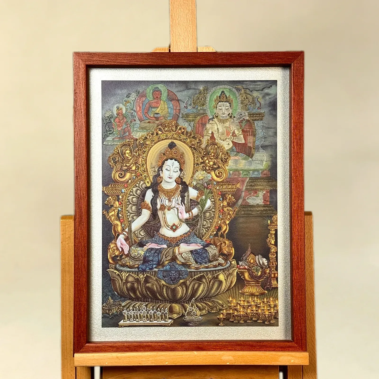 A relief artwork of White Tara, as a wall piece, photographed front on.
